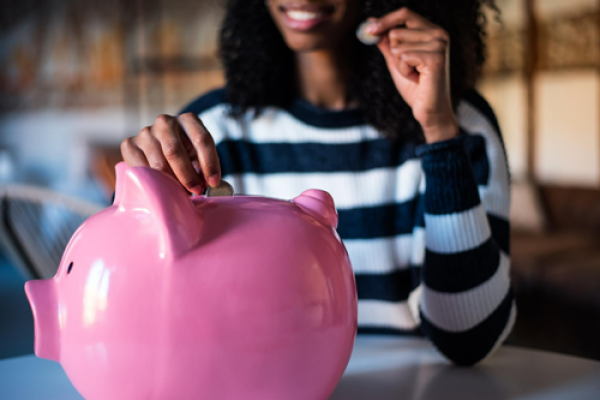 black-woman-with-saving-piggy-bank